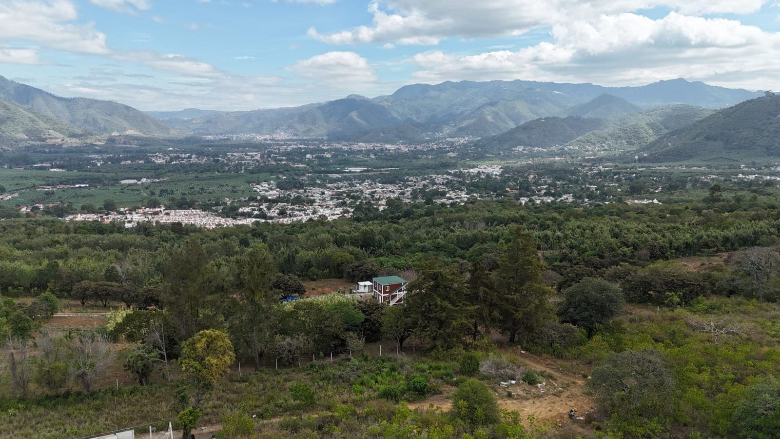 Aerial view of Camino 5 with the family home and the Antigua valley behind